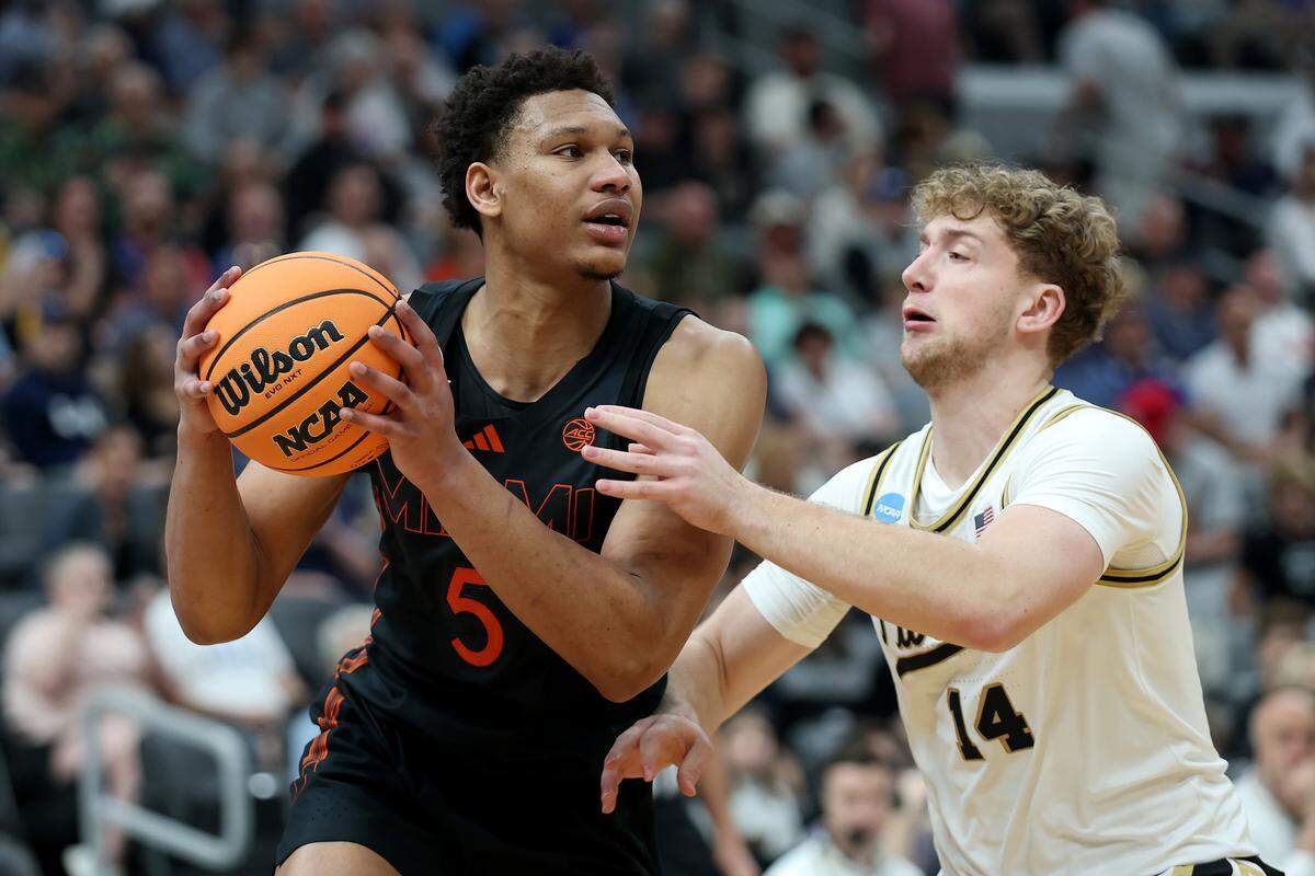 ST LOUIS, MISSOURI - MARCH 22: Malik Reneau #5 of the Miami Hurricanes looks to pass the ball against Jack Benter #14 of the Purdue Boilermakers during the first half in the second round of the 2026 NCAA Men's Basketball Tournament at Enterprise Center on March 22, 2026 in St Louis, Missouri.  (Photo by Jamie Squire/Getty Images)
