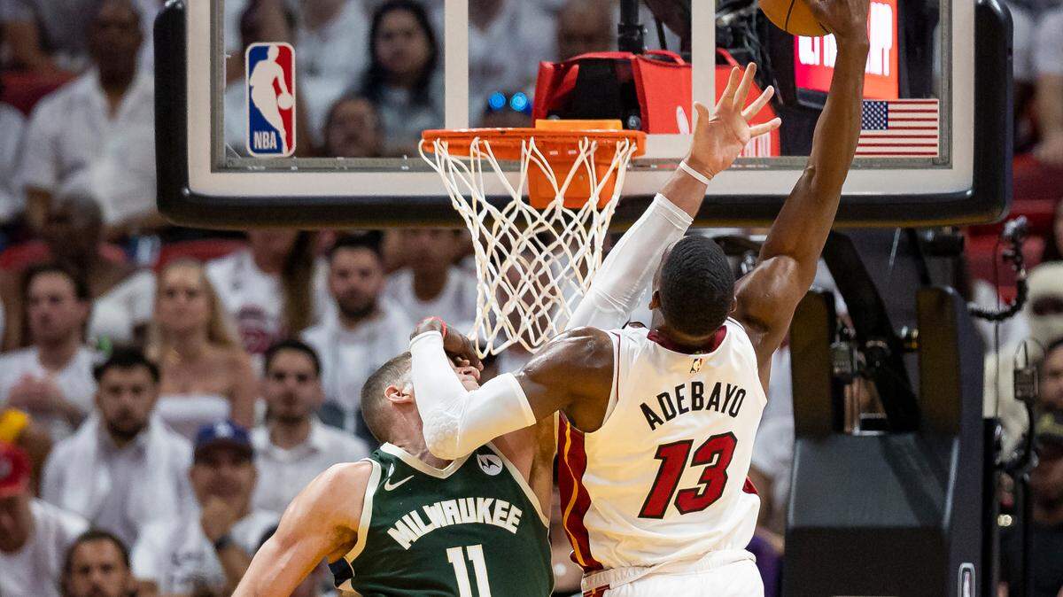 Miami Heat center Bam Adebayo (13) goes to score while Milwaukee Bucks center Brook Lopez (11) defends during the third quarter of Game 4 in the first-round NBA basketball playoff series at the Kaseya Center on Monday, April 24, 2023, in downtown Miami, Fla.