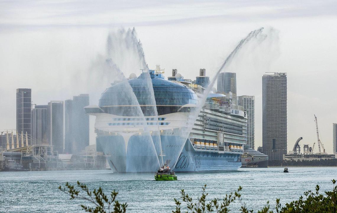 A Miami Dade Fire Boat salutes the Royal Caribbean’s ‘Icon of the Seas’, the world’s largest cruise ship as it heads to the dock early Wednesday morning during its first arrival into PortMiami, January 10, 2024.