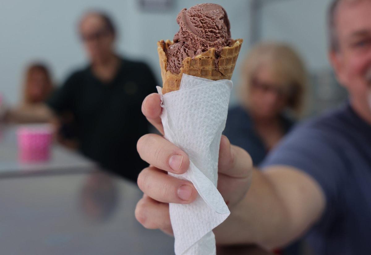 Sam Breit offers a sample of the rich chocolate sorbet, which tastes as rich as ice cream (but isn’t). The Ice Cream Factory will rotate its flavors.