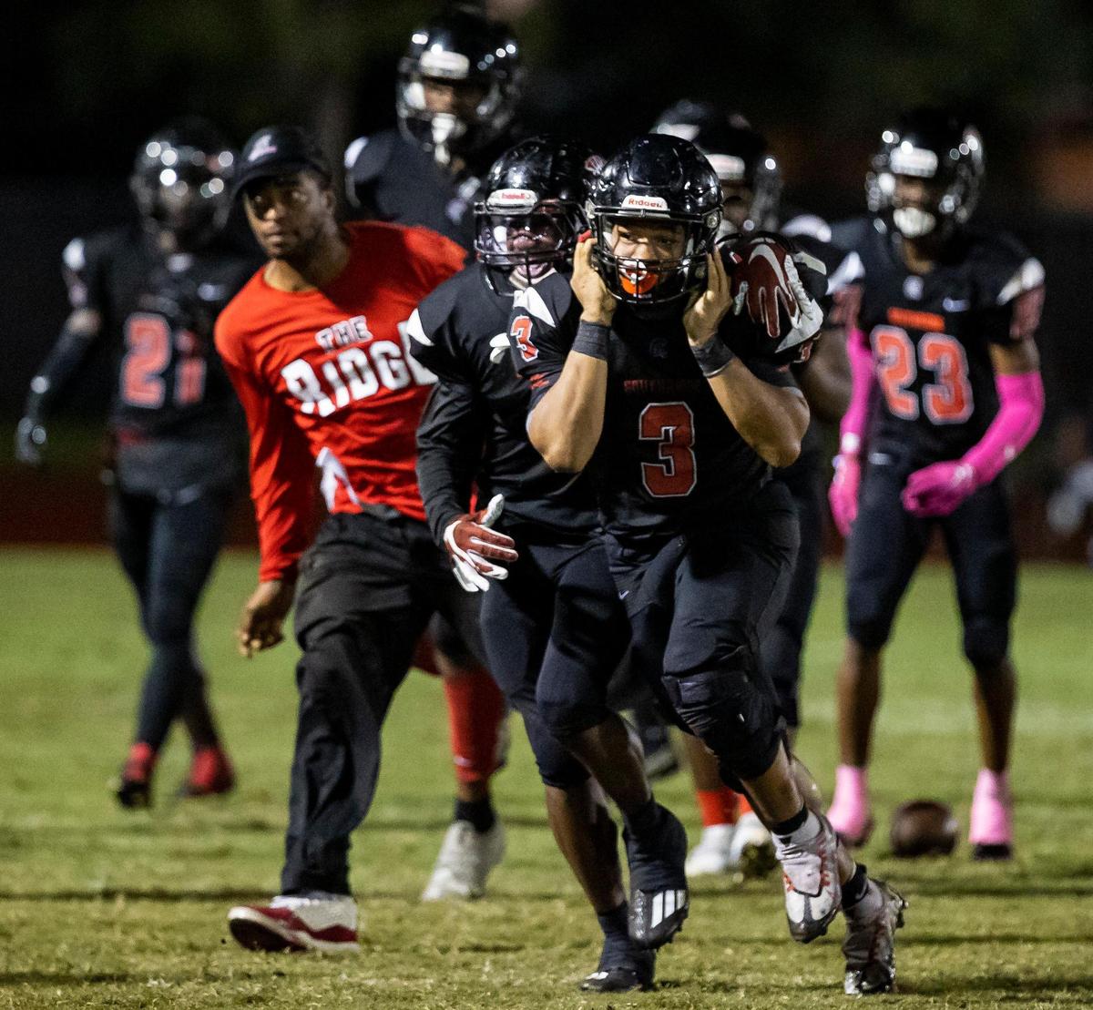 Southridge Spartan linebacker Cameron Davis (3) reacts after catching an interception against the Homestead Broncos during the third half of a high school football game at Southridge Park on Friday, Oct. 14, 2022, in Miami, Fla.