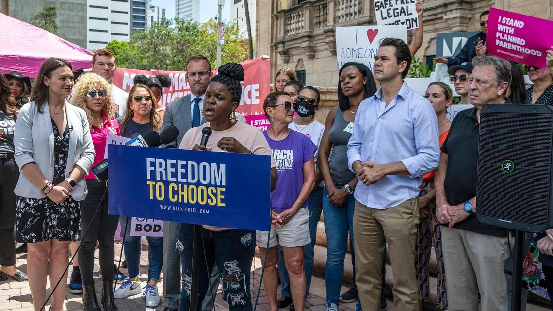 Community organizer Jasmen Rogers at a press conference on abortion rights Tuesday with Democratic gubernatorial candidate and Agriculture Commissioner Nikki Fried (far left) and Miami Commissioner Ken Russell (second from right).