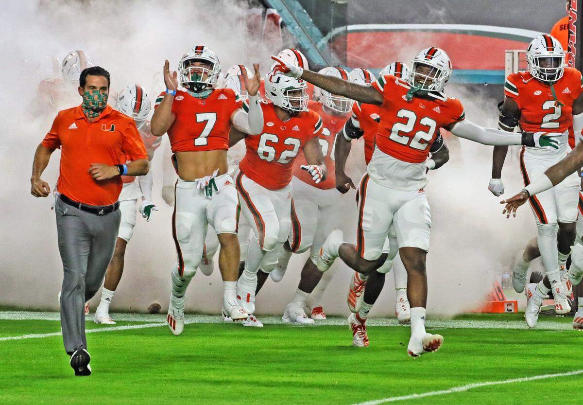 The University of Miami Hurricanes rush the field as they host the UAB Blazers at Hard Rock Stadium in Miami Gardens on Thursday, September 10, 2020.
