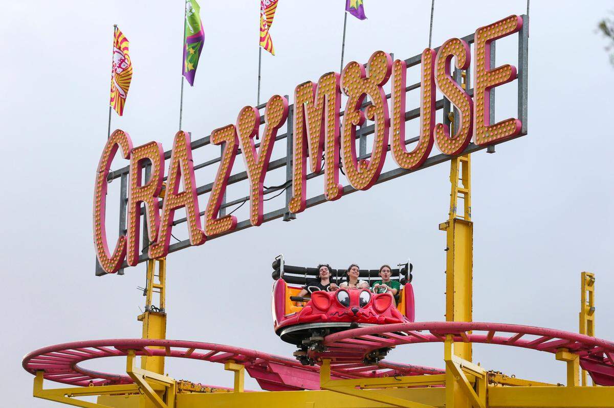 Fairgoers ride the Crazy Mouse during the opening day of the Miami-Dade County Youth Fair at the Miami-Dade Fair & Expo Center in Miami, Florida, on Thursday, March 17, 2022.