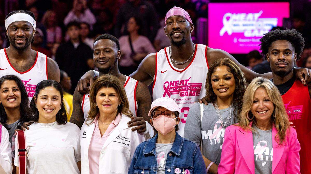 Miami Heat players take a photo with cancer patients and survivors before the start of the annual Red, White and Pink intrasquad Heat scrimmage at Kaseya Center on Wednesday, October 15, 2025, in Miami, Fla.