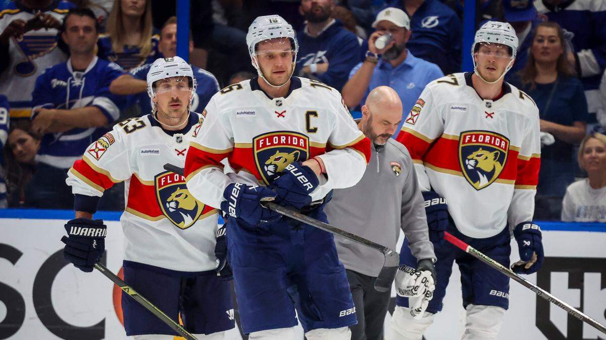 Florida Panthers center Aleksander Barkov (16), center, makes his way to the bench after being hit by Tampa Bay Lightning left wing Brandon Hagel (38) in the third period in Game 2 of the first round in the Stanley Cup Playoffs Thursday, April 24, 2025 in Tampa.