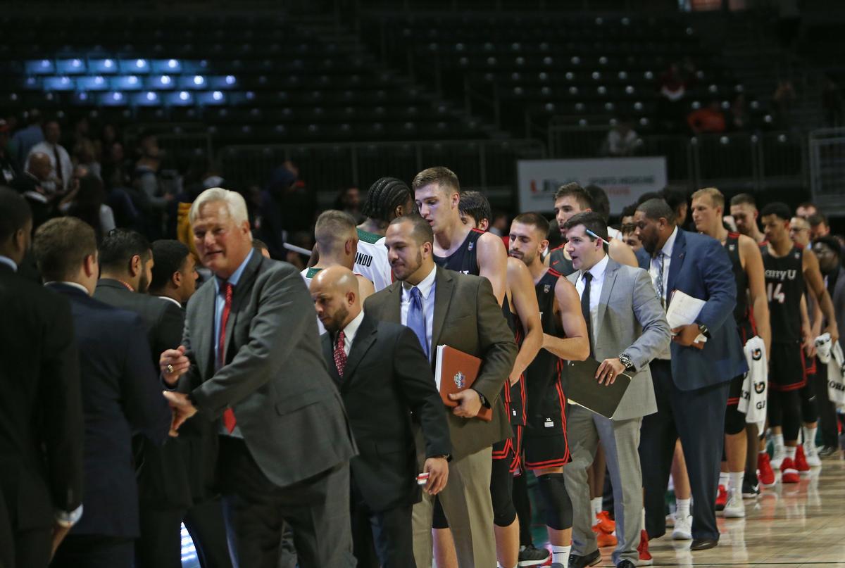 Miami Hurricanes and Barry University Buccaneers  players shake hands after an NCAA college basketball exhibition game at the Watsco Center in Coral Gables on Tuesday, Oct. 30, 2018. The Hurricanes won 91-61.