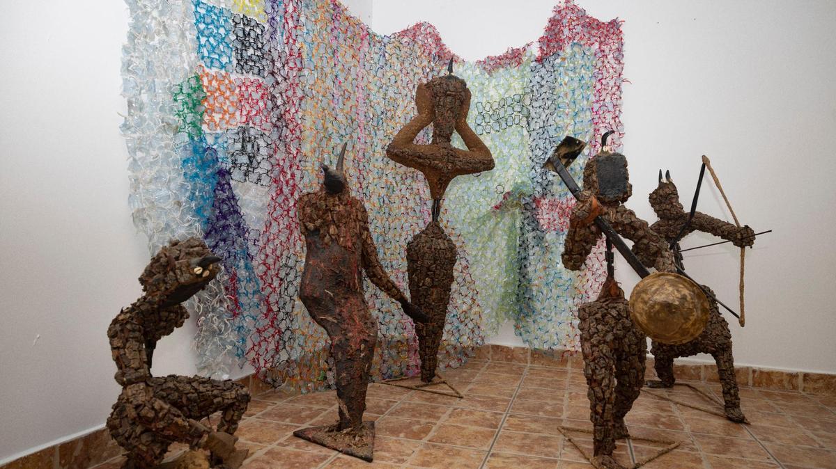 Figures that represent African warriors sit in The Ségou Collection (I’ve Known Rivers), an African art exhibit, during the “Art of Transformation” preview on Monday, Dec. 4, 2023, in the Hurt Building in Opa-Locka. These figures are made out of tree bark, rebar, and bullet shell casings.