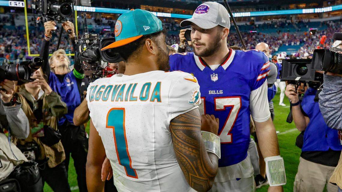 Miami Dolphins quarterback Tua Tagovailoa (1) and Buffalo Bills quarterback Josh Allen (17) meet at mid field after the Miami Dolphins are defeated by the Buffalo Bills at Hard Rock Stadium in Miami Gardens on Sunday, January 7, 2024.