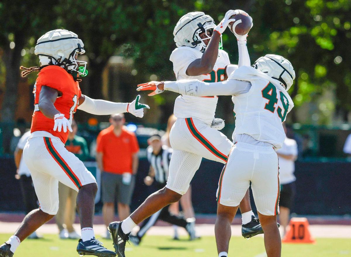 UM defensive back Amari Wallace (26) intercepts a pass intended for wide receiver Malachi Toney (12) in the first half during the Miami Hurricanes football spring game at Cobb Stadium on UM’s campus in Coral Gables, Florida on Saturday, April 12, 2025.
