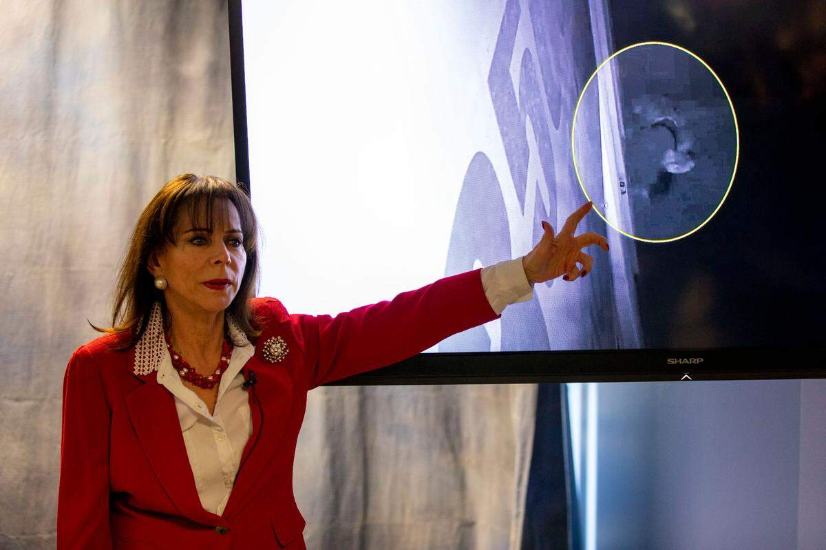 State Attorney Katherine Fernandez Rundle points to CCTV footage provided by private business owners as she explains the details that led to charging real estate agent Willy Maceo with two murders of homeless men in Miami, during a press conference at the State Attorney’s Office in Miami, Florida, on Friday, February 4, 2022.