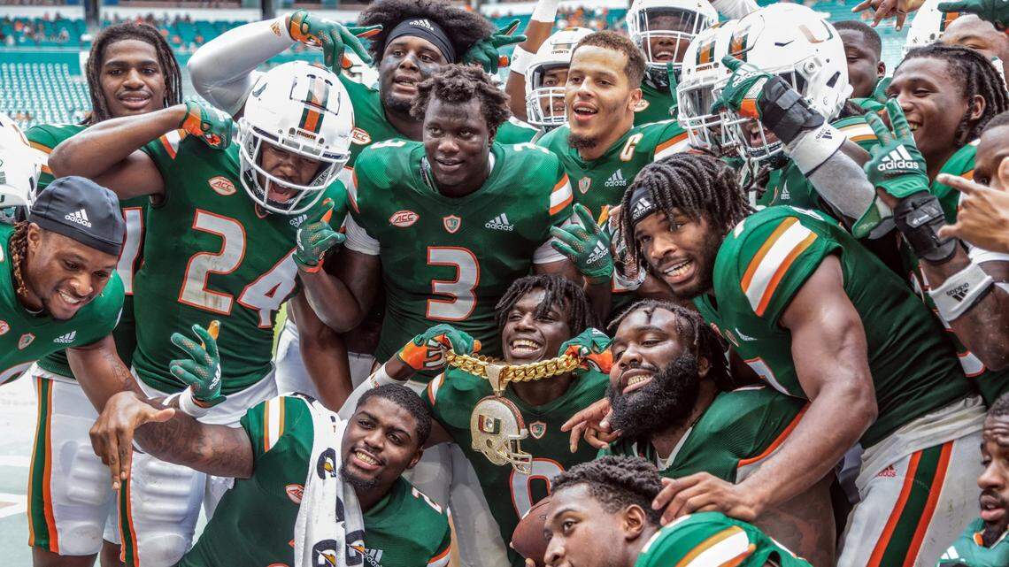 Miami Hurricanes safety James Williams (0) celebrates with teammates and the turnover chain after intercepting a Central Connecticut State Blue Devils pass in the third quarter at Hard Rock Stadium in Miami Gardens on Saturday, September 25, 2021.