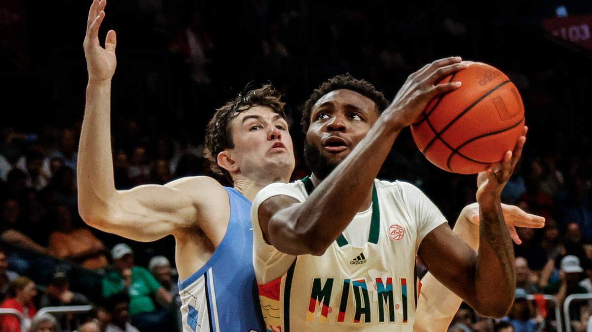 Miami Hurricanes guard Wooga Poplar (5) gets inside as North Carolina Tar Heels guard Cormac Ryan (3) defends in the second half at the Watsco Center in Coral Gables, FL on Saturday, February 10, 2024. Poplar is entering the transfer portal and will not return to Miami for the 2024-25 season.