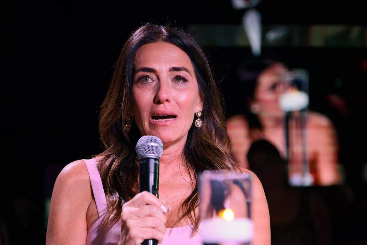 Kathya Puig, mother of boating accident survivor Katerina “Katy” Puig, is overcome with emotions while speaking during the Nicklaus Children's Foundation Diamond Ball at the JW Marriott Marquis in Downtown Miami, Saturday, October 18, 2025. 