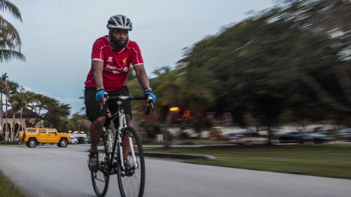 Luther Core regularly rides his bike to help control his blood pressure. He rides his bike around the Granada Golf Course in Coral Gables on a recent Friday evening.