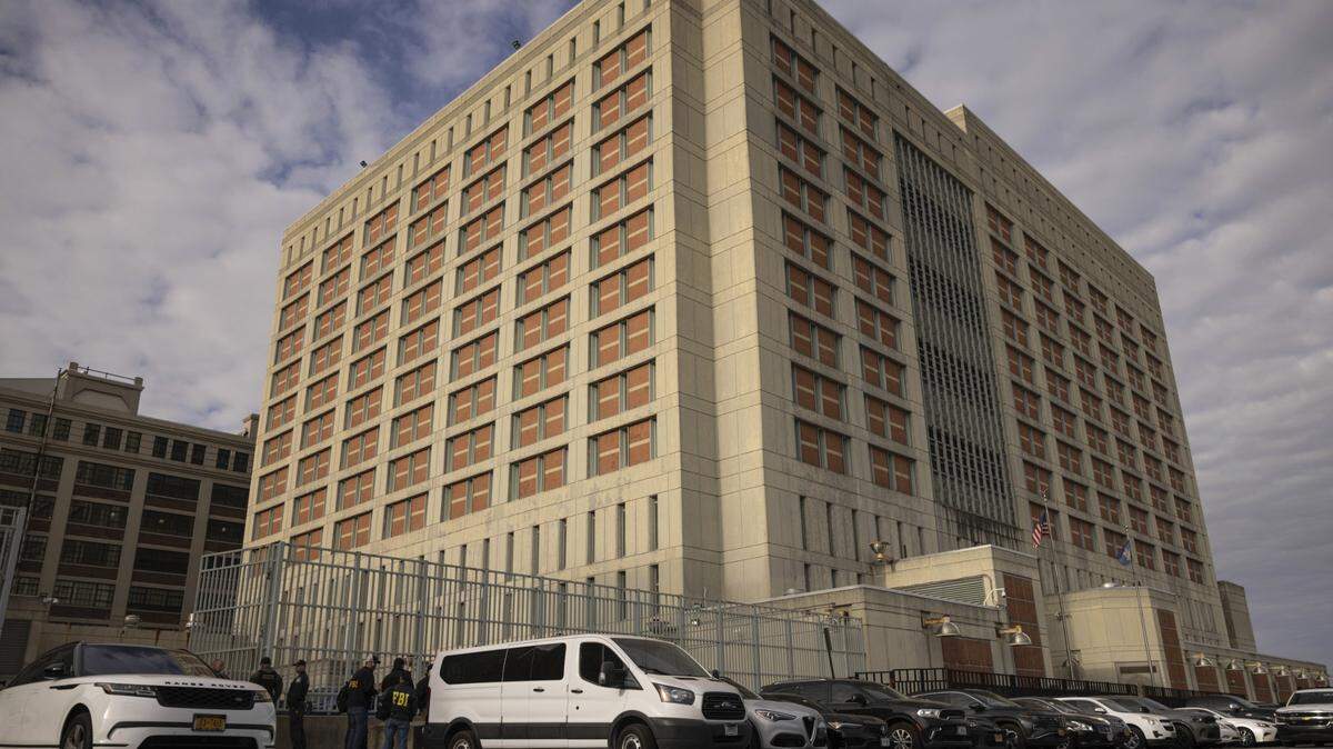 Federal enforcement officers stand outside the Metropolitan Detention Center during an interagency operation, Monday, Oct. 28, 2024, in the Brooklyn Borough of New York.