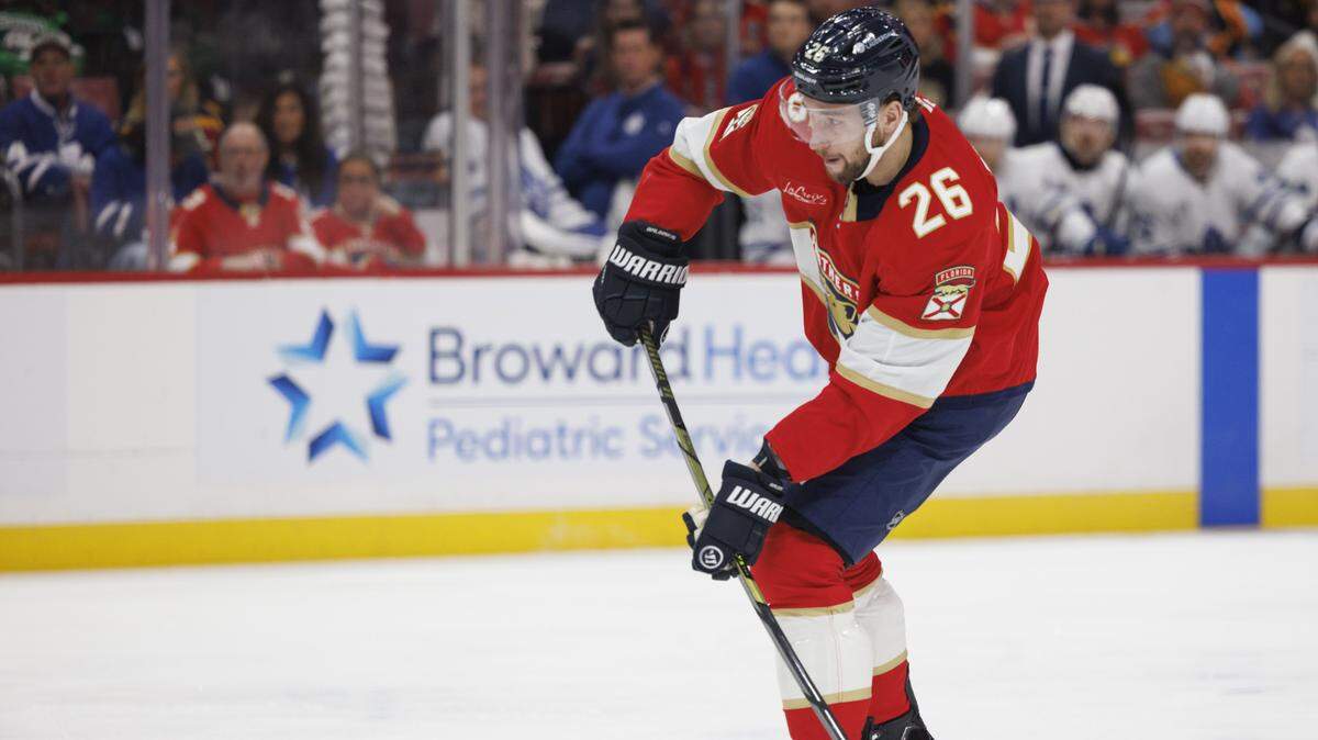 Florida Panthers defenseman Uvis Balinskis (26) passes the puck during the first period of a game against the Toronto Maple Leafs on Tuesday, Dec. 2, 2025, at Amerant Bank Arena in Sunrise, Fla.