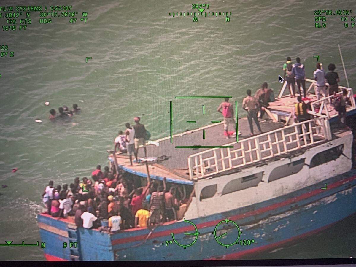 A wooden boat packed with migrants from Haiti arrived in the shallow waters off Ocean Reef Club in Key Largo Sunday, March 6, 2022.
