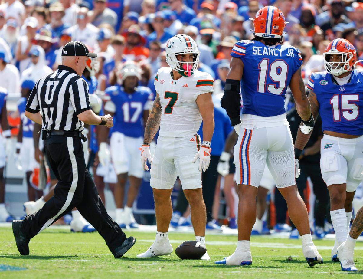 Miami Hurricanes wide receiver Xavier Restrepo (7) reacts after a play during the first half of an NCAA college football game against the Florida Gators at Ben Hill Griffin Stadium in Gainesville, Florida, on Saturday, August 31, 2024.