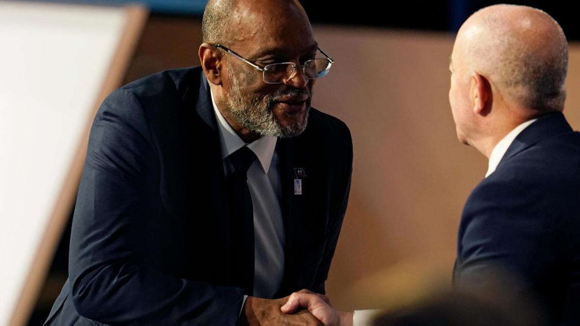 Haitian Prime Minister Ariel Henry, left, shakes hands with Homeland Security Secretary Alejandro Mayorkas during a plenary session at the Summit of the Americas, Friday, June 10, 2022, in Los Angeles.
