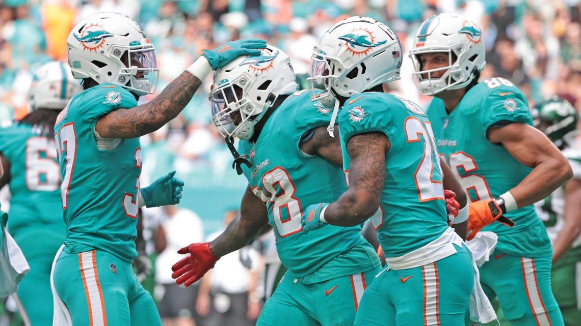 Miami Dolphins running back Duke Johnson (28) celebrates with teammates after scoring in the second quarter at Hard Rock Stadium in Miami Gardens on Sunday, December 19, 2021.