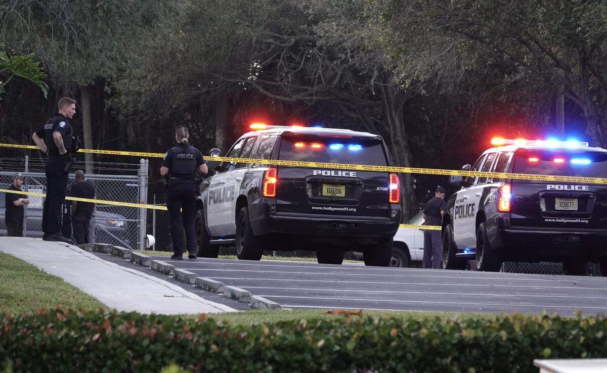 Police stand guard outside Hollywood location of Wartsila, a marine manufacturing facility, after the body of a man was found inside. Police say they think the death was an isolated incident related to two coworkers.