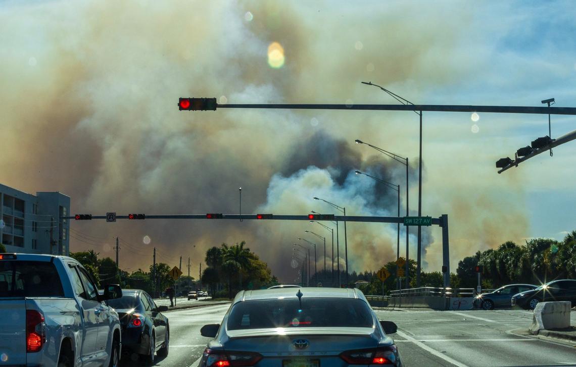 View of heavy smoke caused by a grass fire at SW 137 Avenue and 8 Street in Miami, on Sunday, April 14, 2024.