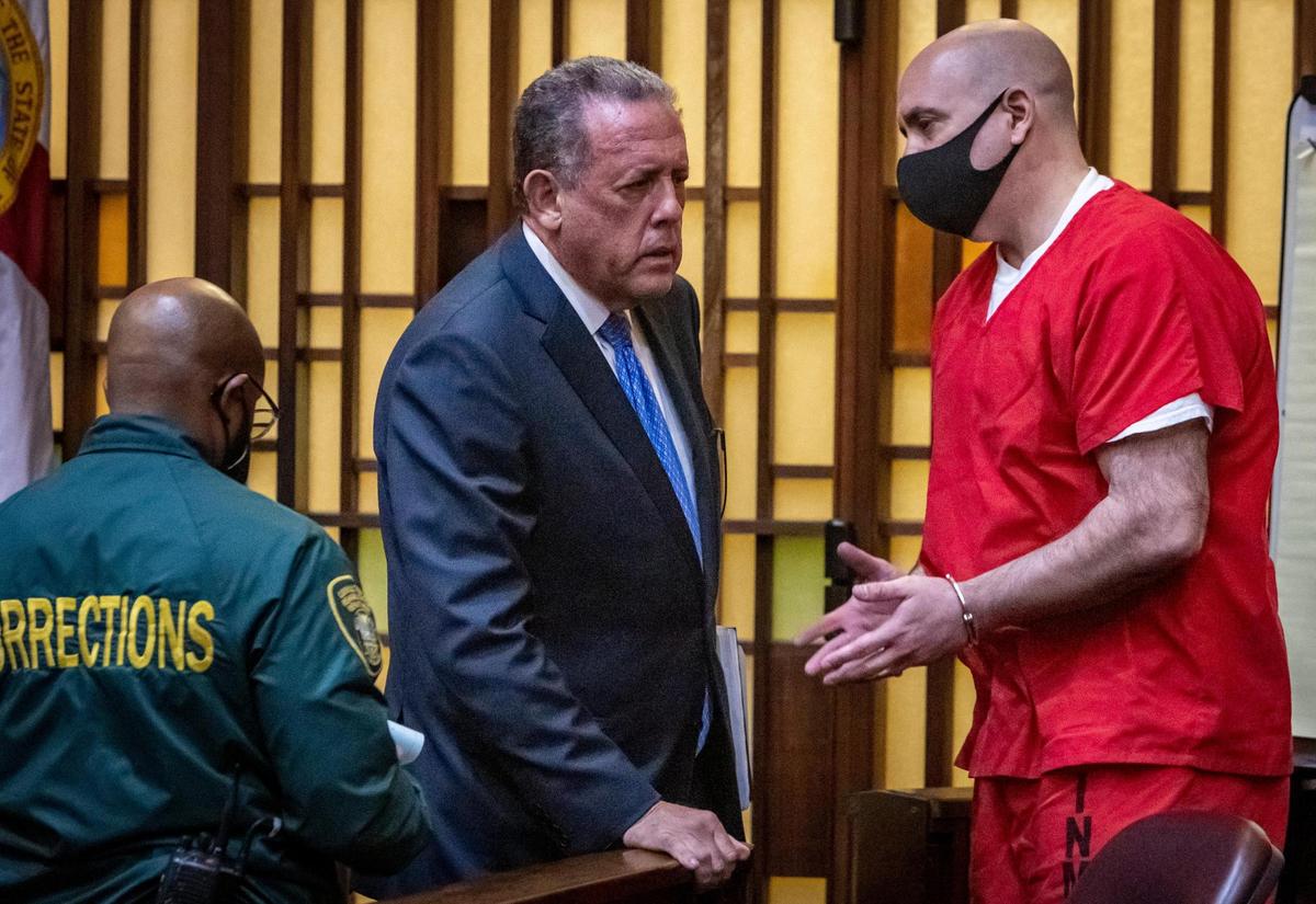 Miami, May 20, 2022 - Braulio Gonzalez, who was convicted of raping family members, left, talks to his lawyer, Bruce Lehr, center, after being sentenced to life in prison..