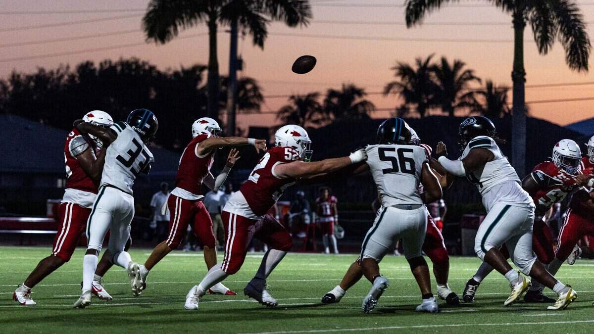Cardinal Gibbons quarterback Jayden Torres (7) throws the ball during a football game against Archbishop McCarthy at Cardinal Gibbons High School on Thursday, August 21, 2025, in Miami, Fla.