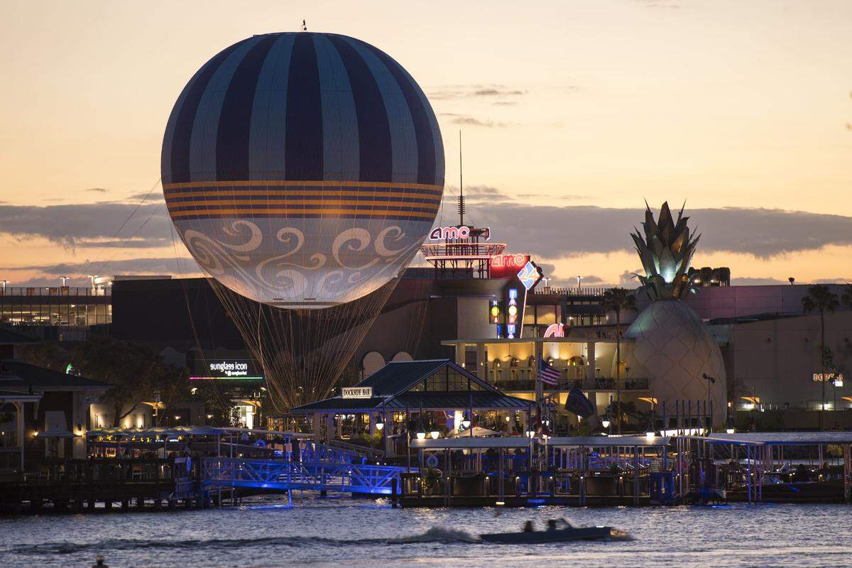 The Characters in Flight balloon soars above Disney Springs in Lake Buena Vista, Florida.