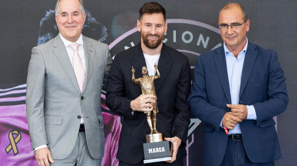 Inter Miami co-owner Jorge Mas, forward Lionel Messi (10), and director of MARCA Juan Ignacio Gallardo are photographed alongside the MARCA America Award during a ceremony at Chase Stadium on Thursday, Oct. 17, 2024, in Fort Lauderdale, Fla. MARCA, a Spain sports media outlet, presented Messi with the award for his contributions to soccer throughout his career.
