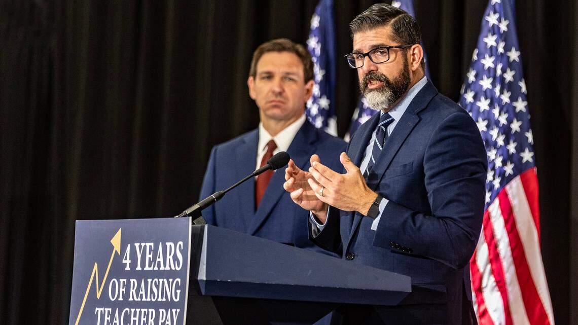 Florida Education Commissioner Manny Diaz with Gov. Ron DeSantis at a press conference in Miami on May 9, 2023.