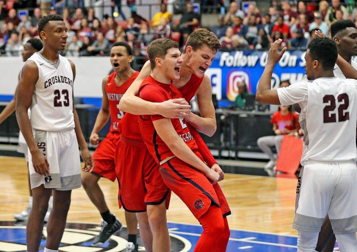 Westminster Academy Ben Middlebrooks (5) grabs Chase Johnson (2) after Johnson's important basket late in the fourth quarter as they play Seffner Christian 4A Boy's Finals State Basketball Championships at the RP Funding Center in Lakeland, Florida, Thursday, March, 7, 2019. Westminster Academy won 77-73.
