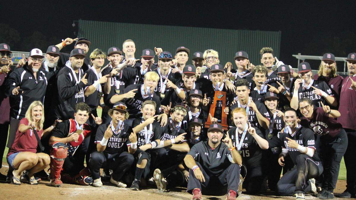 Stoneman Douglas baseball players celebrate after winning their second consecutive state championship on Saturday following a 10-0 victory over Palm Beach Gardens in the Class 7A state final at Hammond Stadium in Fort Myers.