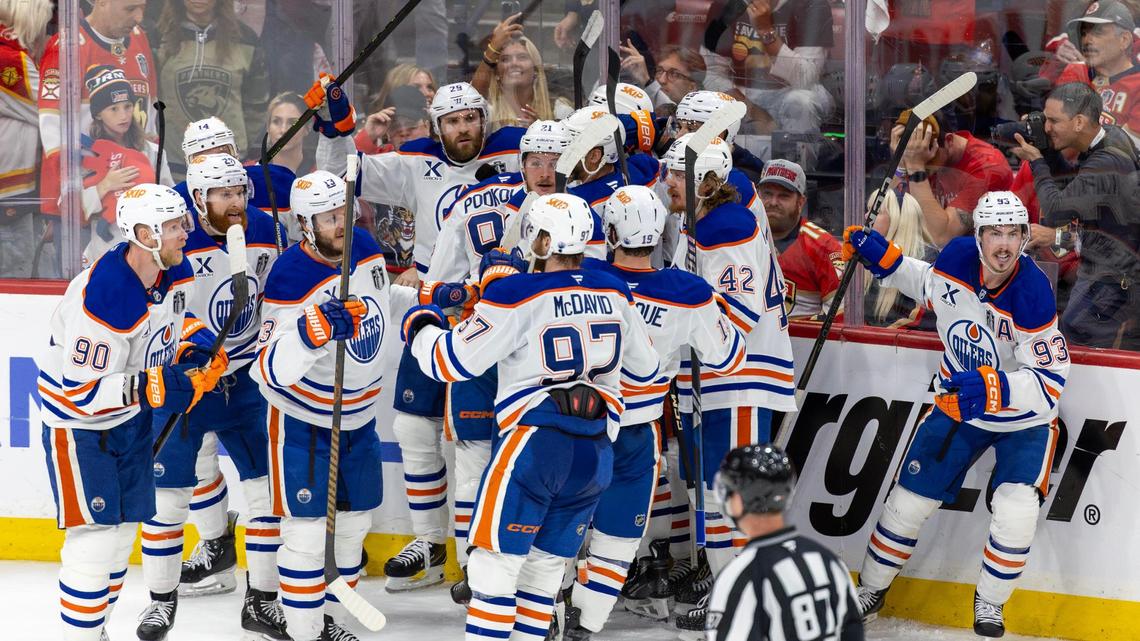 Edmonton Oilers center Leon Draisaitl (29) celebrates with teammates after scoring the game-winning goal in overtime against the Florida Panthers during Game 4 of the NHL Stanley Cup Final at Amerant Bank Arena on Thursday, June 12, 2025, in Sunrise, Fla.