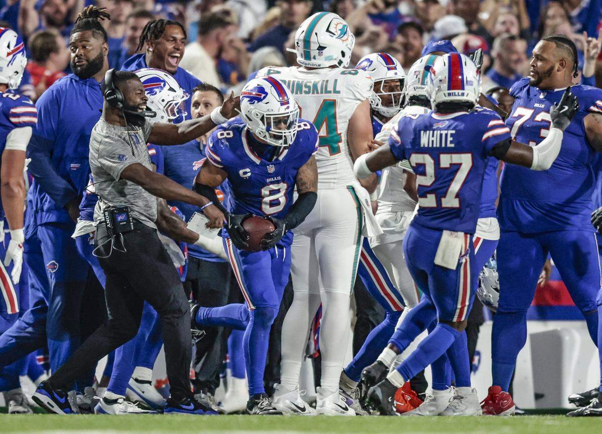 Buffalo Bills linebacker Terrel Bernard (8) comes up with an interception thrown by Miami Dolphins quarterback Tua Tagovailoa (1) in the second half of their NFL football game at Highmark Stadium in Orchard Park, NY, on Thursday, September 18, 2025.