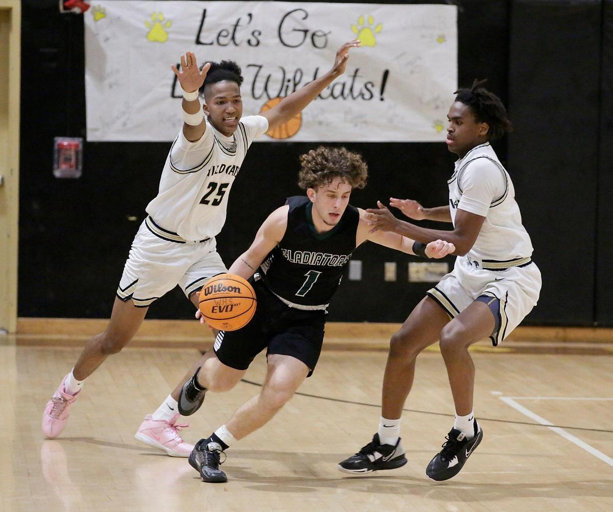 Hialeah Gardens Gladiators Sebastian Pupo (1) dribbles during Region 4-7A boys basketball quarterfinal game against Western Wildcats on Thursday, February 15, 2024 at Western HS in Davie.