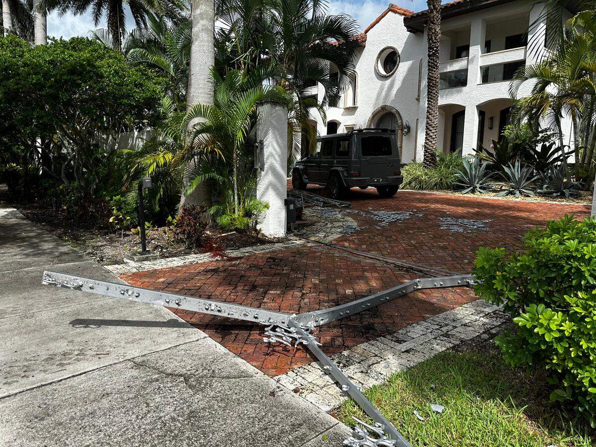 Damage done to the front gate of 1201 NE 83rd St. on Thursday, Sept. 19, 2024, after FBI agents raided the house Wednesday night.