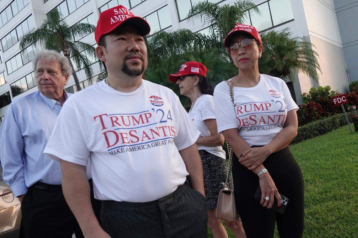 Supporters of Florida Gov. Ron DeSantis, Binh Vo, left, and Trang Le, of Orlando, wait in line for his appearance on “Fox & Friends,” Thursday, May 6, 2021, in West Palm Beach. 