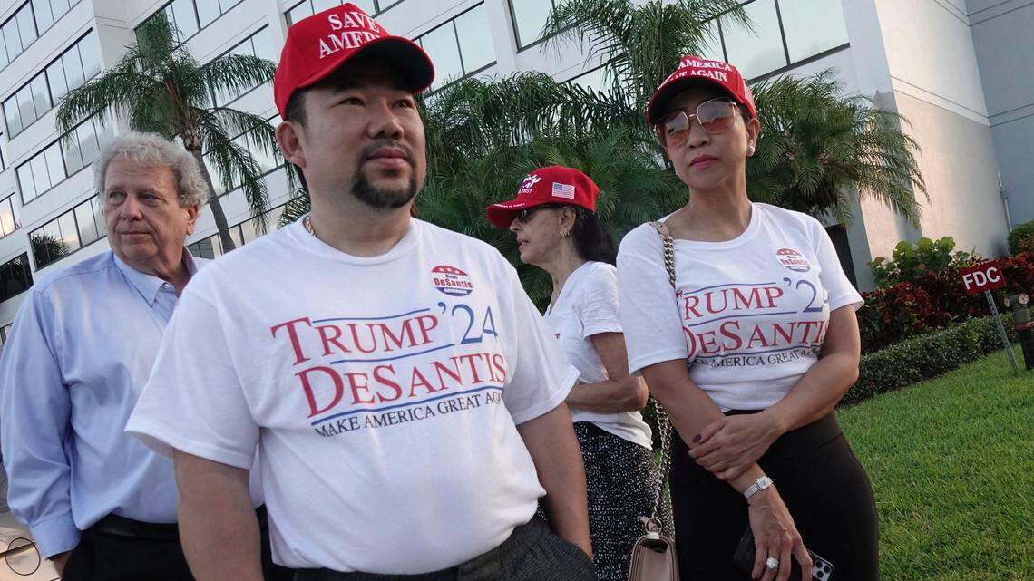 Supporters of Florida Gov. Ron DeSantis, Binh Vo, left, and Trang Le, of Orlando, wait in line for his appearance on “Fox & Friends,” Thursday, May 6, 2021, in West Palm Beach.