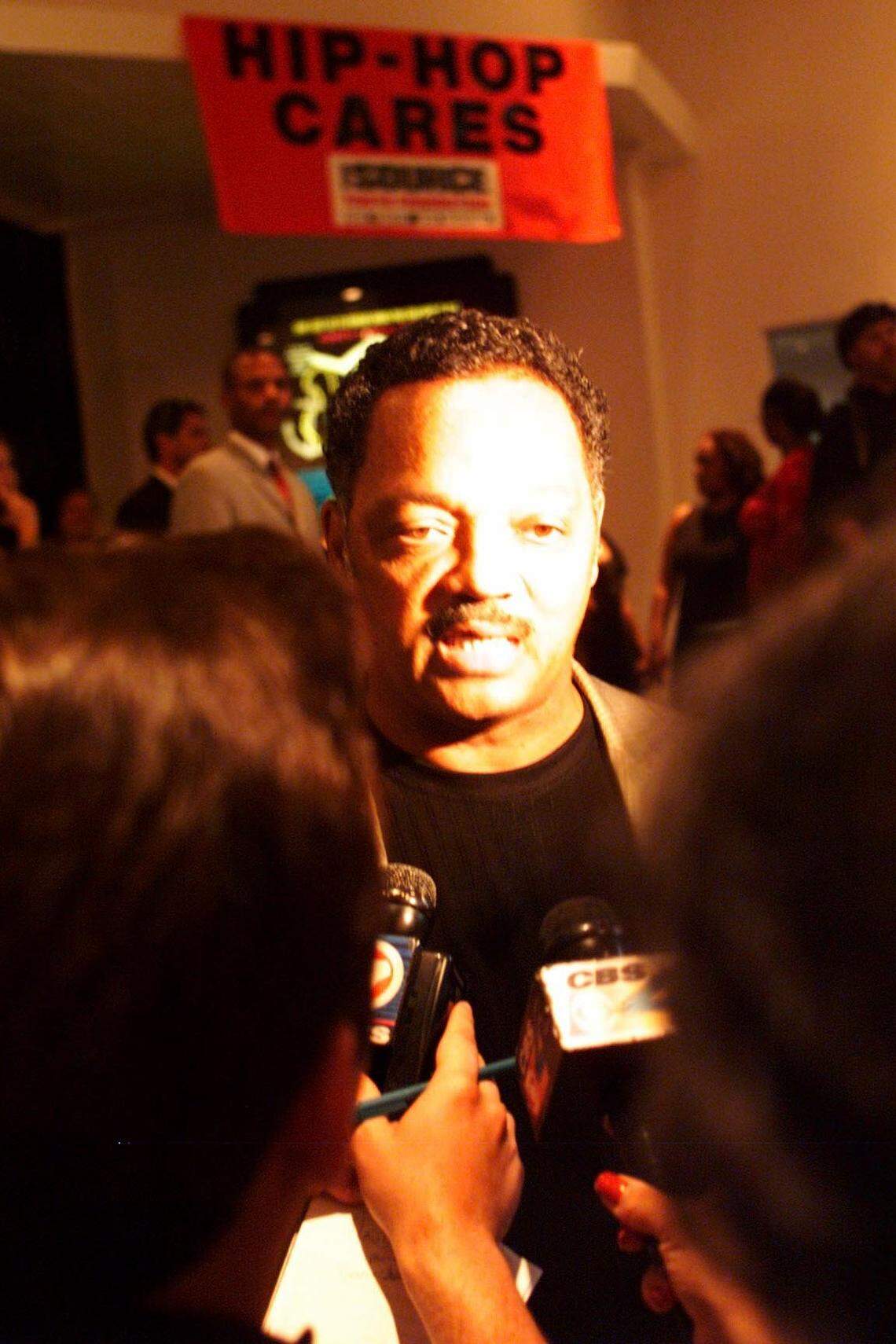 The Rev. Jesse Jackson talks to reporters in 2001 as he arrives at The Source Image Awards in Miami Beach.