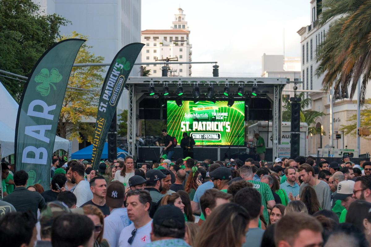 People celebrating on Salzedo Street gather during the John Martin’s 32nd Annual St. Patrick’s Day Street Festival in Coral Gables, Florida, Saturday, March 15, 2025.