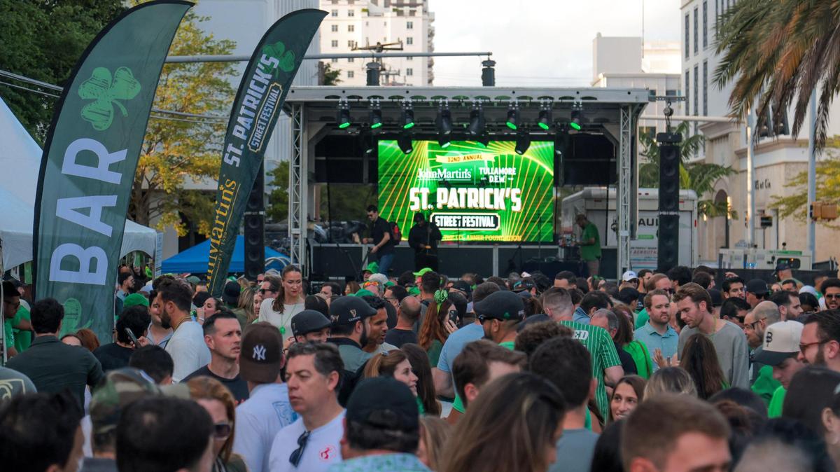 People celebrating on Salzedo Street gather during the John Martin’s 32nd Annual St. Patrick’s Day Street Festival in Coral Gables, Florida, Saturday, March 15, 2025.