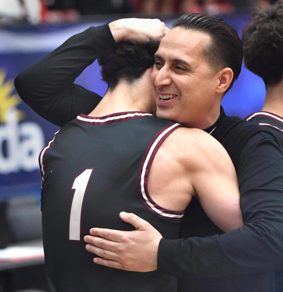 Pembroke Pines Charter’s head coach Dave Roca hugs Maximo Ortega (1) after beating Edgewater in the Class 6A final during the Florida High School State Championships at the RP Funding Center in Lakeland, Fl on Friday March 8, 2024.