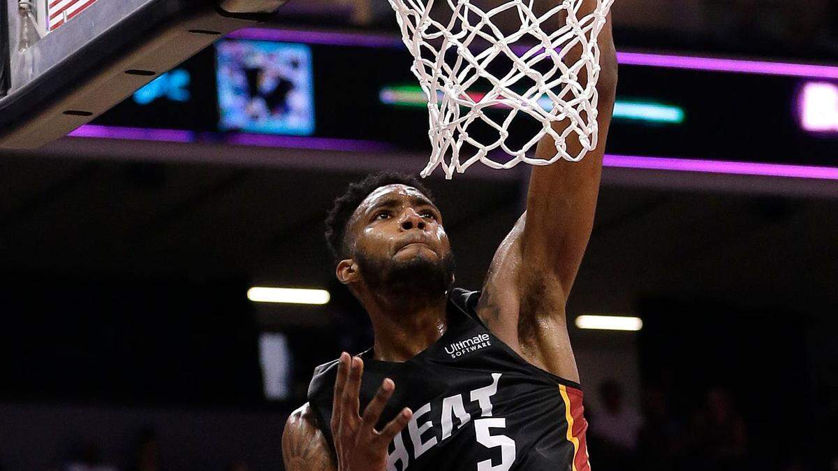 Miami Heat forward Derrick Jones Jr., right, scores over Los Angeles Lakers forward Johnathan Williams during the first half of an NBA summer league basketball game Tuesday, July 3, 2018, in Sacramento, Calif. (AP Photo/Rich Pedroncelli)