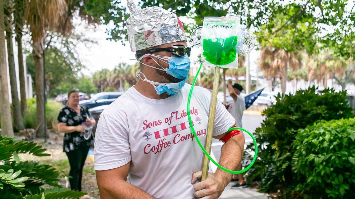 An anti-mask protester who identified himself as Alex Yones, 29, stands outside of the Kathleen C. Wright Administration Building in Fort Lauderdale as Broward County Public Schools held a board meeting on July 28.