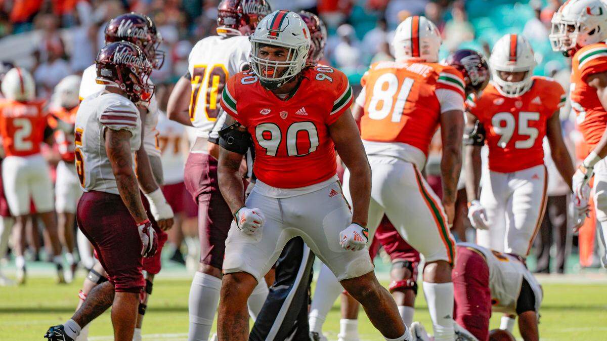 Miami Hurricanes defensive lineman Akheem Mesidor (90) reacts after tackling Bethune Cookman Wildcats quarterback Tyrone Franklin Jr (15) in the first half at Hard Rock Stadium in Miami Gardens on Saturday, September 3, 2022. 