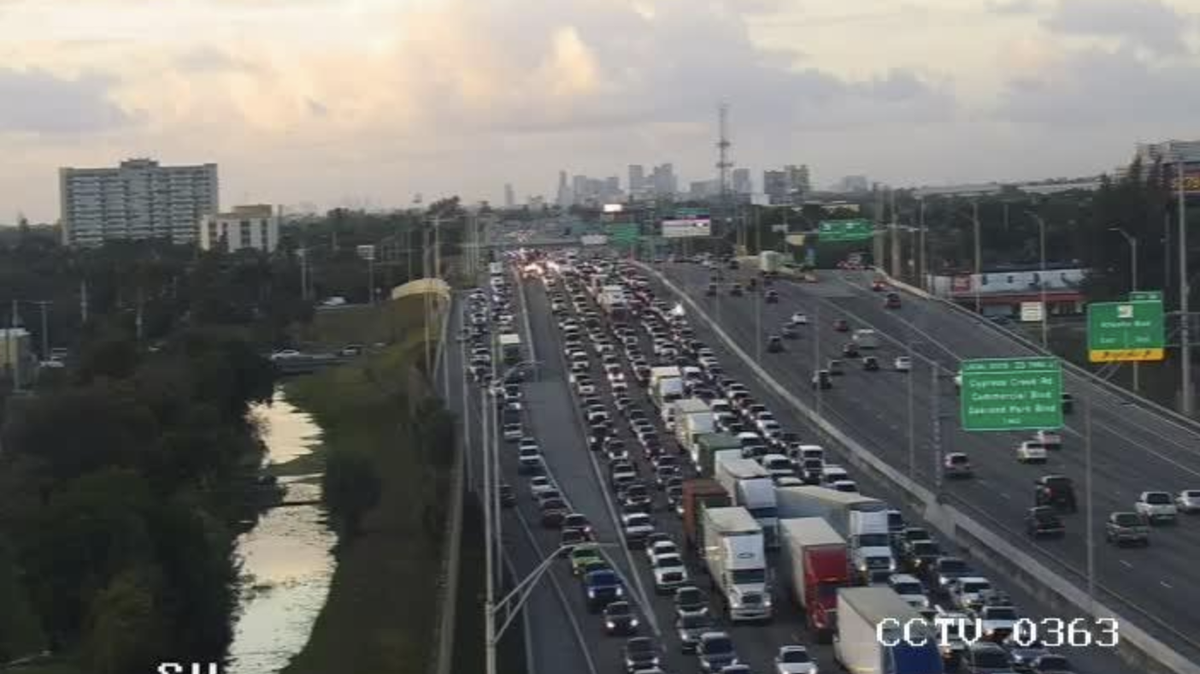 A 21-year-old woman from Virginia was struck and killed after her car got a flat tire on Interstate 95 in North Broward early Thursday, troopers said.