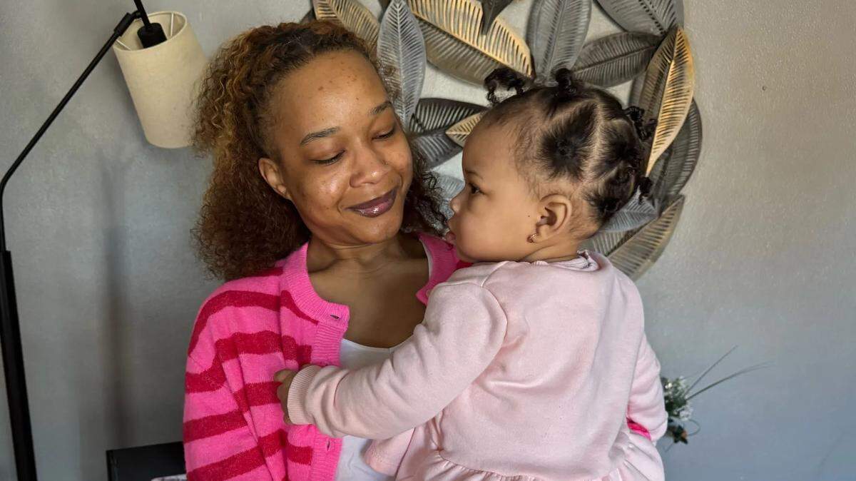 Matte’a Brooks takes care of her daughter inside their home in southern Illinois. Brooks signed up for Medicaid after finding out that her daughter was on the way.