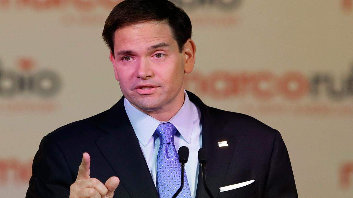 Florida Sen. Marco Rubio gestures as he announces that he is running for the Republican presidential nomination during a rally at the Freedom Tower, Monday, April 13, 2015, in Miami. 